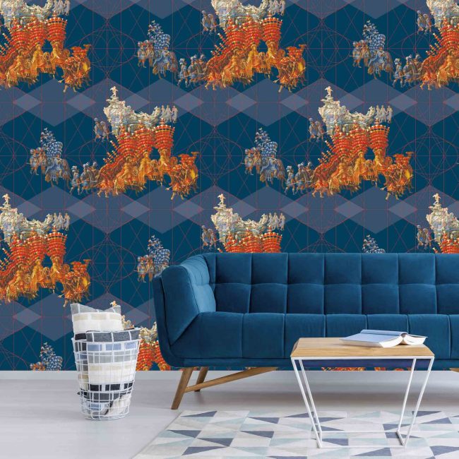 White room with pattern carpet, blue sofa and table